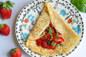 Whole wheat crepes with strawberries and basil