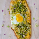 brussels sprouts pizza with an egg on top