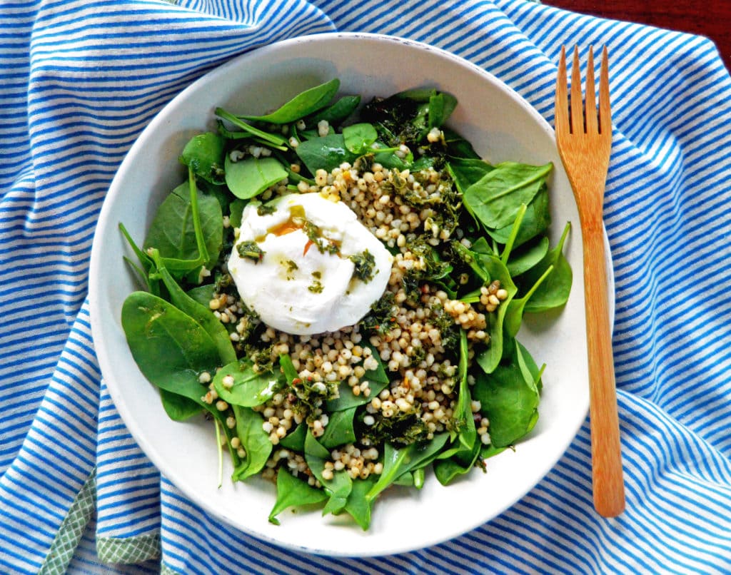 savory breakfast bowl with spinach and sorghum