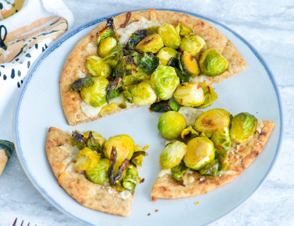 Brussels Sprouts Flatbread on whole wheat naan with mozzarella cheese