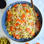 This Coconut Fried Rice is a healthier, easier and more affordable version of a take-out classic. Find out the SECRET ingredients that make this so simple to make!