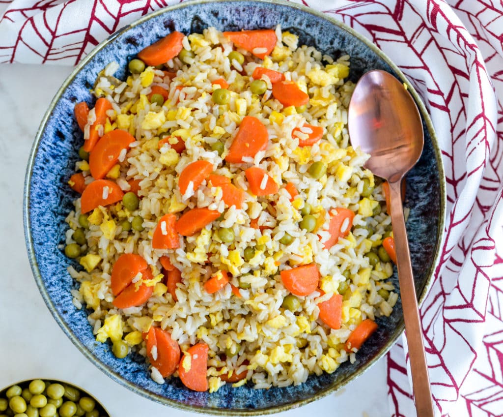 This Coconut Fried Rice is a healthier, easier and more affordable version of a take-out classic. Find out the SECRET ingredients that make this so simple to make!