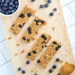 These No-Bake Blueberry Granola bars feature fresh blueberries and have very little added sugar. With just a few simple ingredients and no oven required, there are the perfect nutritious snack to whip up in the heat of the summer or anytime throughout the year! #nobake #granolabars #blueberrybars #healthysnack #healthygranolabar