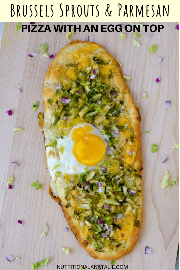Make a homemade, healthy & DELISH pizza with Brussels sprouts, cheese, red onion and an egg on top in less than twenty minutes flat! #healthypizza #breakfastpizza #brusselssproutrecipe #healthybreakfast #vegetarianrecipe #flatbread #veggiepizza