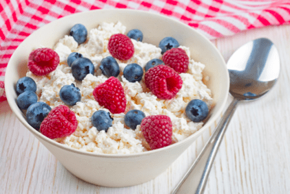 bowl of oatmeal with blueberries and raspberries 