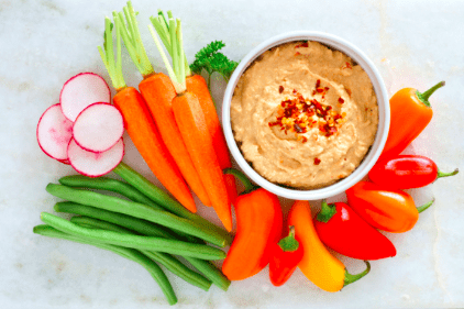 mixed veggies with hummus on marble background 