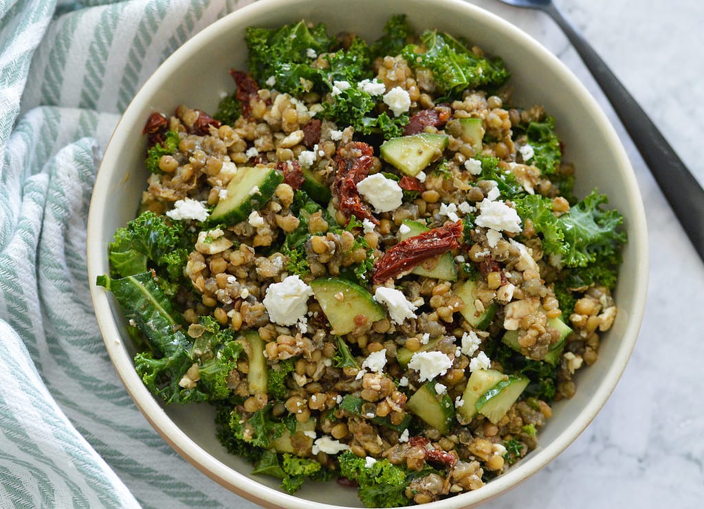 lentils mixed with sun dried tomatoes, kale, cucumber and feta