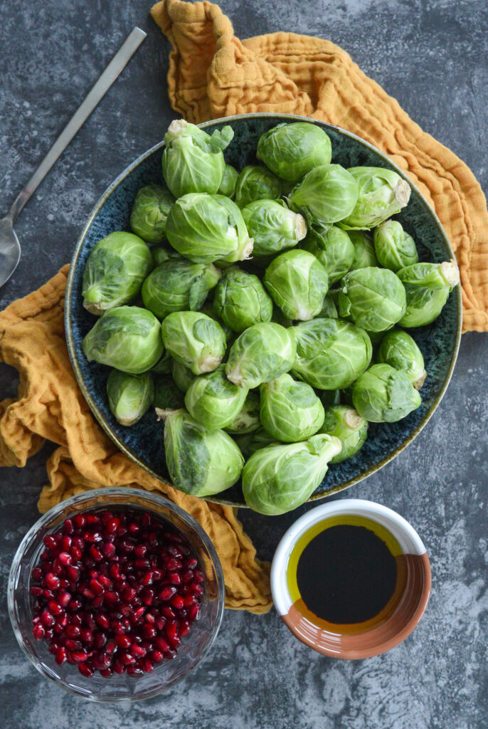 brussels sprouts with pomegranate seeds and balsamic vinegar and oil