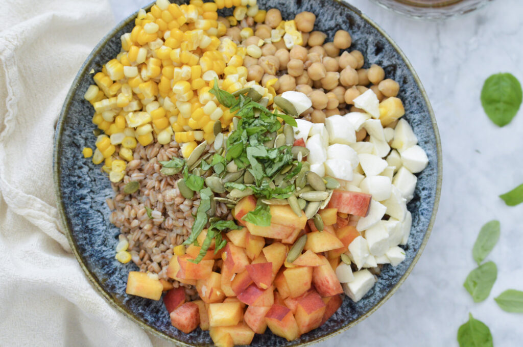 Farro salad with corn, peaches, chickpeas, basil, fresh mozzarella and a balsamic vinaigrette