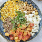 Farro salad with corn, peaches, chickpeas, basil, fresh mozzarella and a balsamic vinaigrette