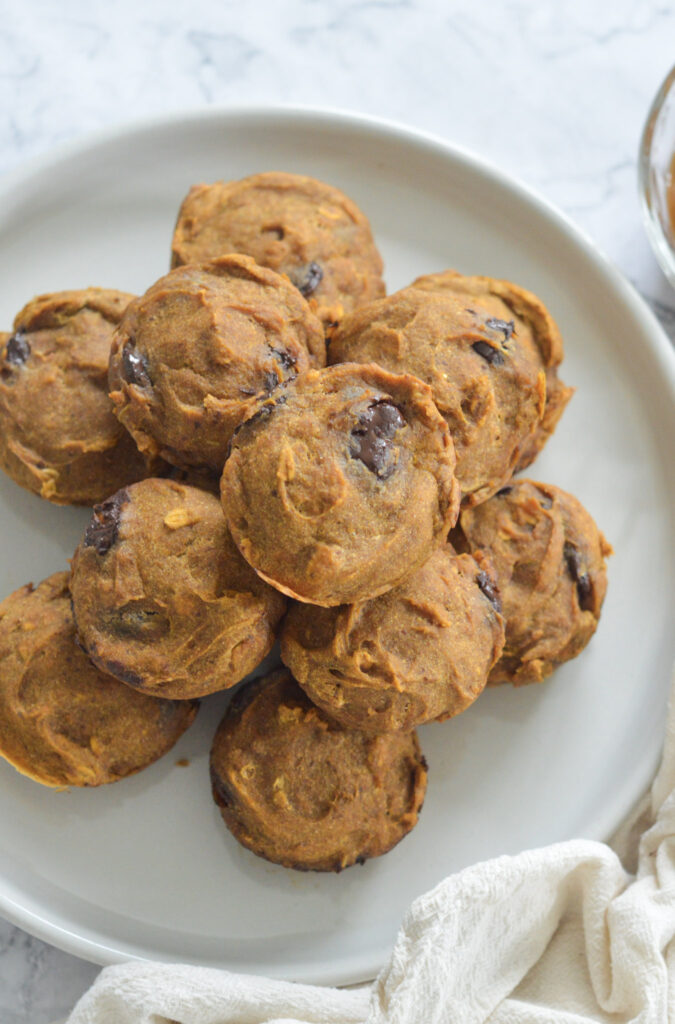 Vegan Pumpkin Chocolate Chip Muffins in a pile