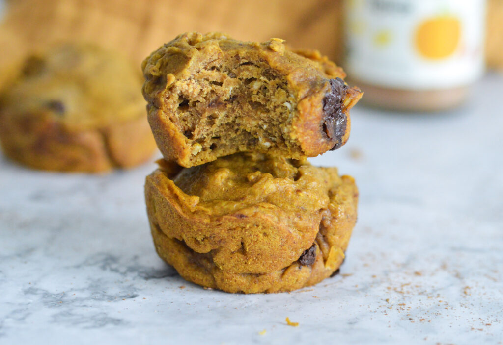 two vegan pumpkin chocolate chip muffins