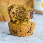 two vegan pumpkin chocolate chip muffins