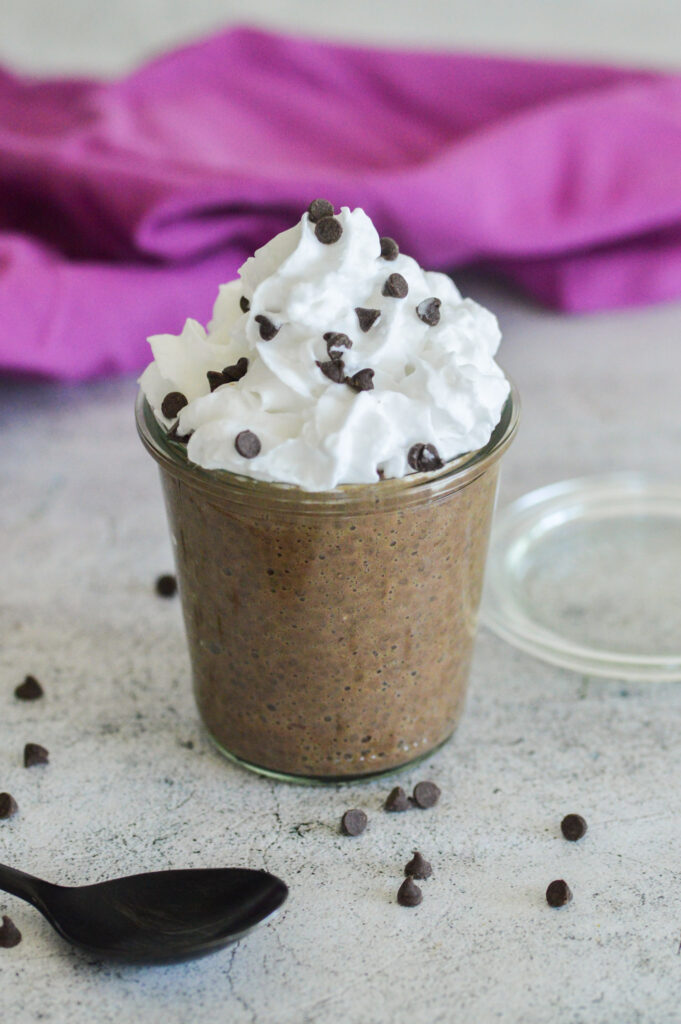 chocolate chia pudding with whipped cream and chocolate chips